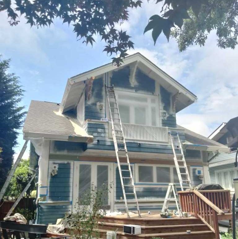 House in process of painting